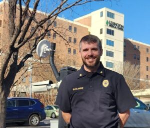 Picture of a security leader in front of a hospital